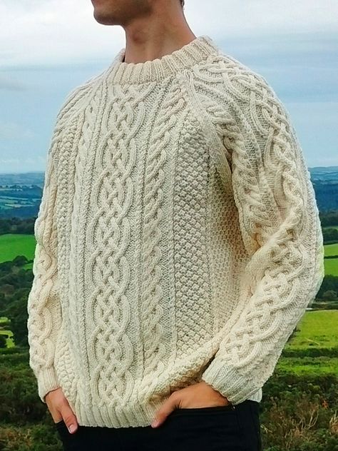 Wrap yourself in warmth and tradition with this luxurious hand-knitted Aran jumper, crafted with care in the heart of Cornwall. Made from 100% premium Canadian wool, this soft and cozy sweater blends timeless Celtic design with high-quality materials for unbeatable comfort. Featuring classic Aran cable patterns, this cream jumper offers a perfect mix of style and durability, ideal for chilly days. Whether you're strolling the coast or staying in by the fire, this one-of-a-kind piece is a must-ha Celtic Crochet, Aran Jumper, Cream Jumper, Aran Sweater, Country Wear, Celtic Design, Wool Jumper, Cable Sweater, Celtic Designs