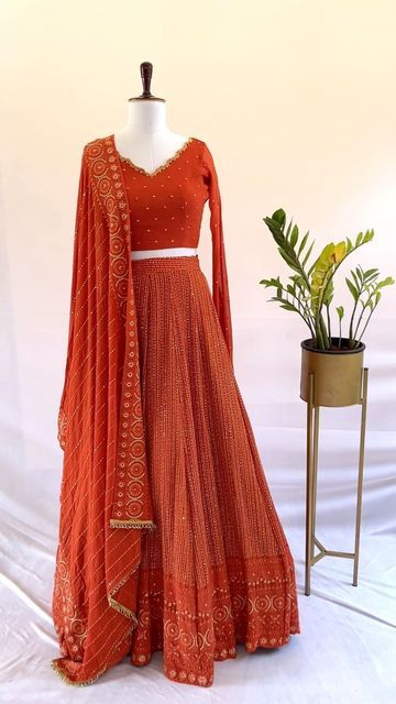 Burnt orange Bridal Lehenga Rust Orange Indian Outfit, Burnt Orange Desi Outfit, Lehenga Top Design, Burnt Orange Lehenga, Burnt Orange Lengha, Rust Colour, Unstitched Orange Lehenga For Wedding, Orange Lehenga Colour Combinations, Orange Fitted Dola Silk Lehenga