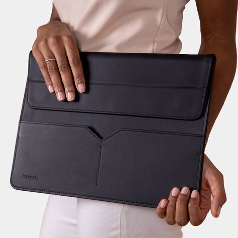 The small and compact laptop sleeve with an invisible built-in stand provides enough room without being too bulky. It is an instant conversion to the built-in stand which allows you to adjust position. The card slot and the front pockets are designed to act as extra storage. Constructed with %100 calfskin full grain leather, and suede interior lining. Interior is incredibly soft to the touch, scratch-free and provides extra protection. The innovative fold-in flap structure makes it sturdy and st Leather Laptop Sleeve, Leather Laptop, Office Accessories, Design Graphique, Extra Storage, My Vibe, Laptop Sleeve, Bag Pattern, Full Grain Leather