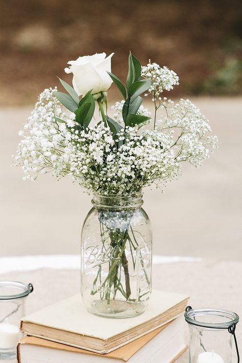 The reception centerpieces featured white roses and baby's breath in mason jars.  	Photo by J. Masciana Photography 	Flowers by Simply Beautiful Flowers & Events Affordable Wedding Centerpieces, Babies Breath, Simple Centerpieces, Wedding Table Decorations, Deco Floral, Affordable Wedding, Wedding Table Centerpieces, Baby's Breath, Rustic Wedding Decor