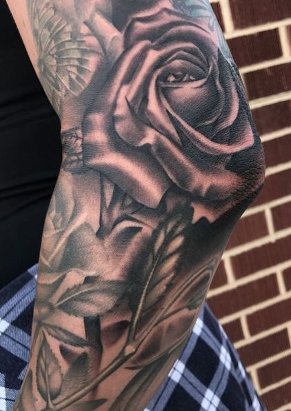 Soft Black and Grey Rose tattoo on the Elbow Rose Elbow Tattoo Mens, Rose Tattoo On Elbow Men, Elbow Rose Tattoo Men, Rose On Elbow Tattoo, Men’s Elbow Tattoo Ideas, Rose Tattoo On Elbow, Rose Elbow Tattoos For Women, Elbow Rose Tattoo, Rose Tattoo Elbow