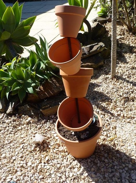 How to Create a Terracotta Pot Display (Tippy Pots) – Piglet in Portugal Stacked Flower Pots, Plant Tower, Stacked Pots, Pot Display, Flower Tower, Herb Pots, Terracotta Pot, Diy Garden Projects, Terracotta Pots