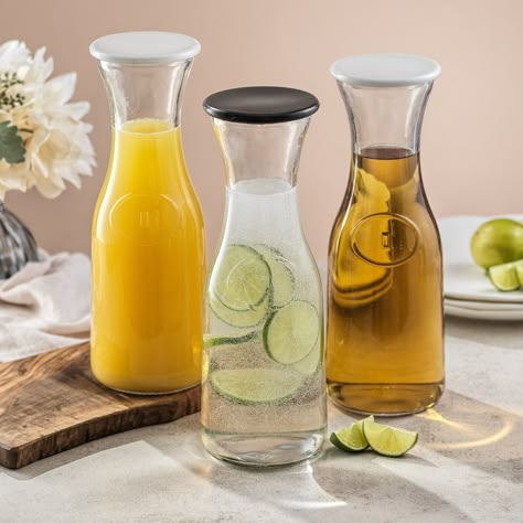 "Buy the JoyJolt® 35oz. Hali Glass Carafe Bottle Pitchers Set at Michaels. com. Host the perfect party with this carafe set from JoyJolt! Host the perfect party with this carafe set from JoyJolt! Every host and hostess needs a set of restaurant-quality glass pitchers. This set from JoyJolt will have you ready to host brunch, baby showers, bridal showers, and holiday parties! Need brunch bridal shower ideas for a large group? Add these carafes to your mimosa kit! Not just for parties, either! Det Brunch Baby Showers, Host Brunch, Catering Drinks, Sangria Pitcher, Bedside Water Carafe, Iced Tea Pitcher, Lemonade Pitcher, Cocktail Pitcher, Brunch Decor