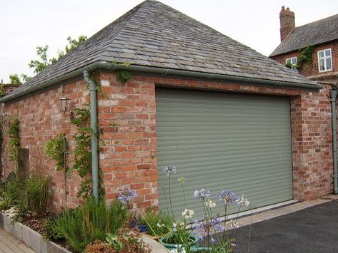 A charwell green electric roller shutter garage door on a modern detached garage. Windows Upvc, Garage Door Colors, Garage Door Paint, Electric Garage Doors, Roller Door, Painting Shutters, Garage Remodel, Bungalow Homes, Roller Doors