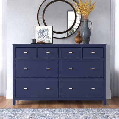 This 8-drawer dresser double dresser adds storage and the right amount of coastal style to your bedroom or guest room. The frame is made from solid and engineered wood with a crisp, versatile finish, and it's accented with sleek T-shaped drawer handles with a gold hue for a distinctive contrast. This dresser features four smaller upper drawers and four wide lower drawers for clothes, extra bedding, and delicates. They're also soft-closing and fully extendable with safety stops. Plus, this dresse Navy Dresser, Dresser Wood, Blue Dresser, 8 Drawer Dresser, Dresser Sets, White Dresser, White Chests, 2 Drawer Nightstand, Upholstered Panels