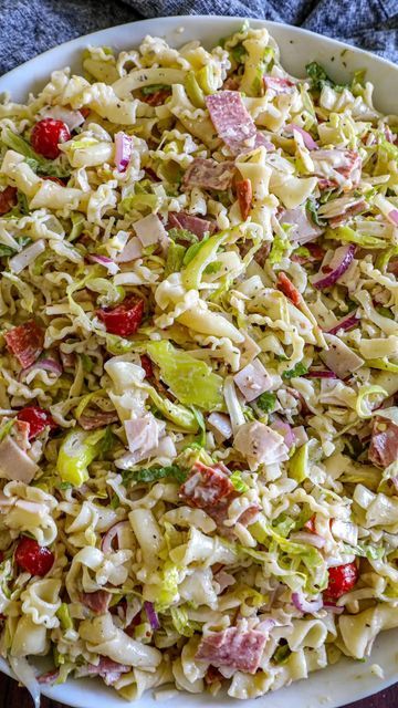 Lauren Nagel on Instagram: "Grinder Pasta Salad 

If you loved the viral sandwich, then I know you need to save and try this version of a grinder pasta salad as well! It’s perfect for entertaining or meal prepping as well. 

Here’s what you need 👇
* 1 lb Pasta short cut noodles work best 
* 1 cup Turkey diced or shredded 
* 1 cup Salami diced 
* 1 cup Pepperoni diced 
* 8 oz Provolone Cheese diced or shredded 
* 4 cups Romained Lettuce shredded 
* 1 medium Red Onion diced small 
* 1 cup Cherry Tomatoes halved 
* 16 oz. Pepperoncini Peppers sliced thin 
Dressing 
* 1 cup Mayo use a light mayo if you prefer 
* 1 cup Olive Oil
* 1/3 cup Red Wine Vinegar 
* 1 cup Parmesan Cheese grated 
* 2 tsp Italian Seasoning
* 2 tsp Black Pepper 
* 1 tsp Red Pepper Flakes

https://www.bonappeteach.com/gri Viral Sandwich, Grinder Pasta Salad, Suddenly Salad, Pepperoncini Peppers, Brisket Chili, Keto Dinners, Salad Dishes, Pasta Salad Recipe, Summer Cooking