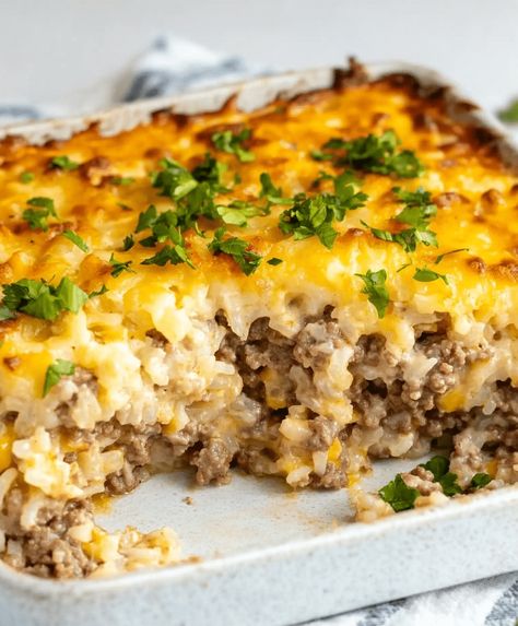 Easy Hamburger Rice Casserole combines ground beef, rice, veggies, and creamy soups for a hearty, family-friendly meal in under an hour. Ground Beef Family Recipes, Minute Rice Hamburger Casserole, Hamburger Rice Vegetable Casserole, Cauliflower Rice And Ground Beef, Ground Beef Broccoli Rice Casserole, Brown Rice And Hamburger Recipes, Hamburger And Minute Rice Recipes, Hamburger And Cauliflower Rice Recipes, Hamburg And Rice Recipes