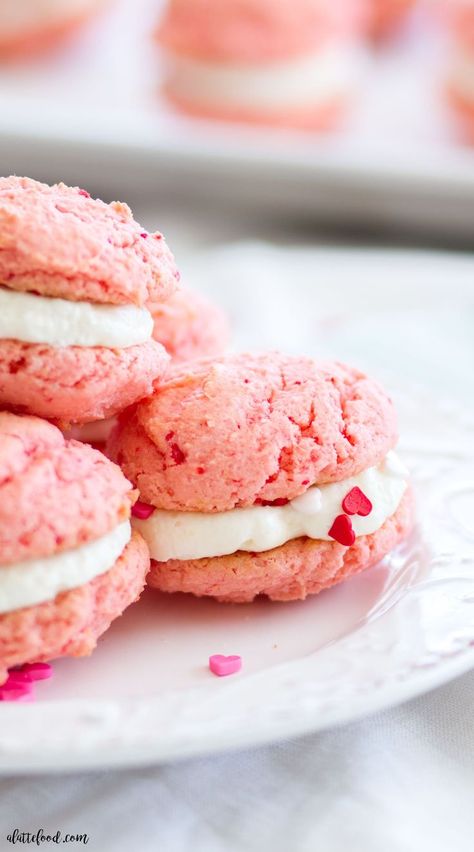 These strawberry sandwich cookies are filled with sweet marshmallow cream cheese frosting! These easy cake mix strawberry cookies are only 3-ingredients, and the frosting is only 2-ingredients! You can't beat these pretty strawberries and cream sandwich cookies for a Valentine's Day dessert or spring dessert! Pretty Strawberries, Strawberry Sandwich, Strawberry Cake Mix Cookies, Sandwich Cookies Filling, Miss Cake, Spring Dessert, Pink Cookies, Strawberry Cake Mix, Marshmallow Cream