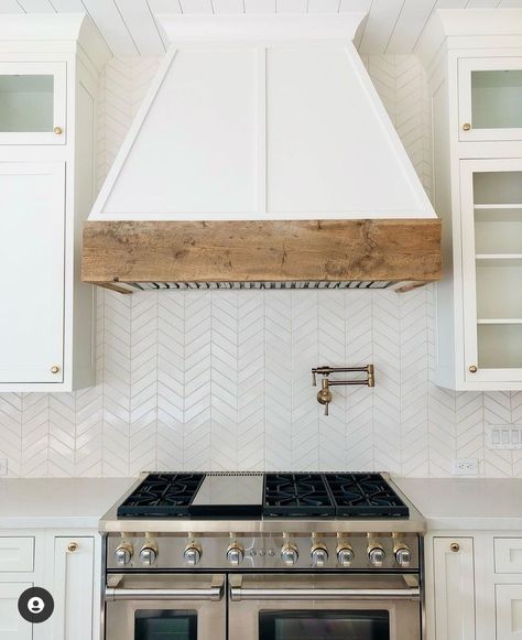 Kitchen Hoodfan Ideas, Range Hood With Wood Beam, White Wooden Hoods Over Stove, Wood Stove Hood White Cabinets, Wood Wrapped Kitchen Hood, Coastal Range Hood Ideas, Faux Kitchen Hood, White Oak Oven Hood, White Kitchen Hood With Wood Trim