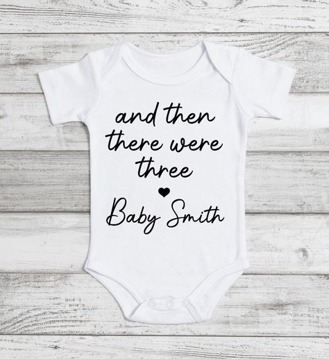 Excited to share this item from my #etsy shop: And Then There Were Three Baby Onesie Baby Announcement Bodysuit Pregnancy Announcement Baby Shower Gift Baby Coming Soon Bodysuit New baby #babyonesiereveal #andthentherewere #babyrevealfamily #babyrevealhusband #babyannouncement #pregnancyreveal #newbabycomingsoon #onesieannouncement #expectingnewparent Onesie Baby Announcement, Baby Reveal Cakes, Baby Coming Soon, Rocky River, Baby Announcements, Third Baby, Vinyl Ideas, Baby Reveal, Baby Coming