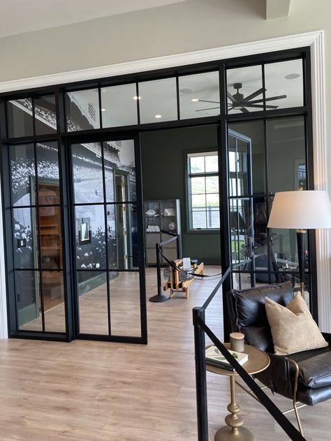 Glass Wall Dining Room, Glass Wall Black Frame, Black Glass Panel Sliding Doors, Internal Black Metal Glass Doors, Black Metal And Glass Barn Door, Black Frame Glass Partition, Glass Panel Wall, Living Room Lounge, Black Glass