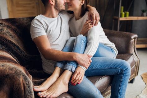 Free Photo | Young smiling couple sitting on couch at home in casual outfit, love and romance, woman and man embracing, wearing jeans, spending relaxing time together Couple Sitting On Couch, Intimacy Photos, Sitting On Couch, Couple Sitting, Relaxing Time, Love And Romance, Relationship Building, Travel Illustration, Relax Time