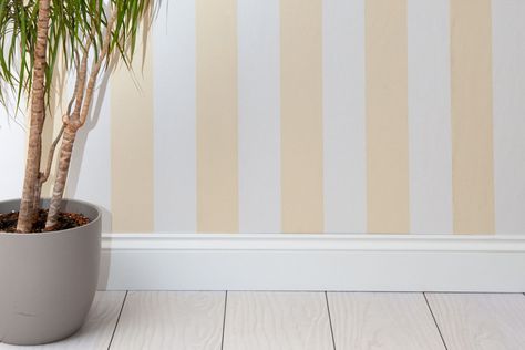 Learn how to paint stripes on your walls, from planning the perfect layout to choosing colors to painting like a professional. Diy Striped Wall, Stripped Painted Walls, Wall Stripes Paint Ideas, Stripe Paint Ideas For Walls, Fabric On Walls, Paint Edgers, Painting Horizontal Stripes, Paint Edger, Striped Walls