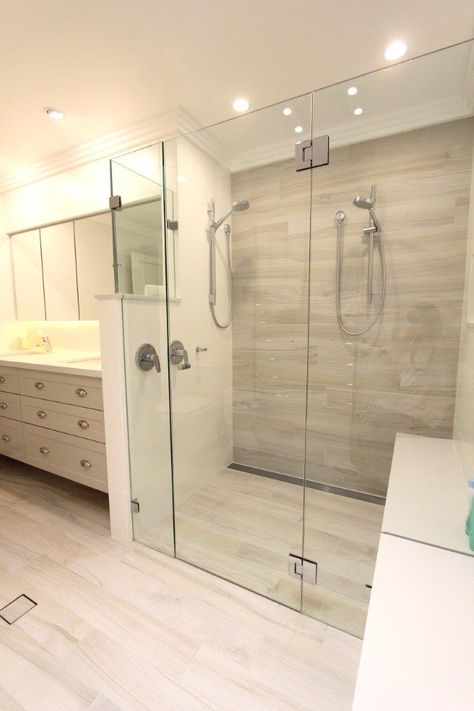 St Ives - Master Ensuite Double shower, integrated bench seat inside/outside shower, topped in Ceasar stone. White washed timber look plank tiles - Tilesmart St Ives Double Shower Ensuite, Modern Curio Cabinet, Shower Ensuite, Double Showers, Shower Design Ideas, Tub To Shower Remodel, Shower Remodel Diy, Doorless Shower, Small Shower Remodel