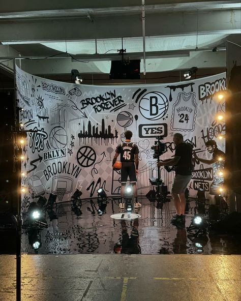 Cool project alert 🚨🏀 I created the set design for the @brooklynnets media day!!! When @yesnetwork reached out and asked if I was interested in creating this year’s backdrop, it was a no-brainer! As you know, I’m a big basketball fan and it was so fun to create a design inspired by Brooklyn. Today we got to go behind the scenes and see everything in action! 📽️ It was so awesome to see my artwork blown up, behind all of the Nets players! Keep a lookout for my artwork on @yesnetwork this season... Media Day, Basketball Fans, Brooklyn Nets, Set Design, Behind The Scenes, Brooklyn, This Year, Basketball, Fan