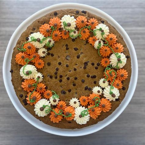 New season, new treats! 🍂🎃 Our Pumpkin Chocolate Chip Cookie Cakes are now available for online ordering (in-store pickup only!). This cookie cake is full of pumpkin and spice flavor and finished with decorative buttercream pumpkins. This delicious, fall-inspired cookie cake is the perfect addition to all your autumn gatherings or a sweet gift to bring along. Order yours today and make your fall festivities even sweeter! Serves 8. PLEASE ALLOW 48 HOURS FOR MADE-TO-ORDER COOKIE CAKE. THANK YOU. COOKIE CAKE/SLICES ARE PICK-UP ONLY! Shipping not available for this item. Please select store pick-up and provide pick up details at checkout. Gift Card included. Please let us know your message in the 'Gift Messages" at your shopping cart. Buttercream Pumpkins, Buttercream Designs, Cookie Cake Designs, Cake Slices, Thanksgiving Cakes, Chocolate Chip Cookie Cake, Cookie Cake Birthday, Cookie Cakes, Pumpkin Chocolate Chip