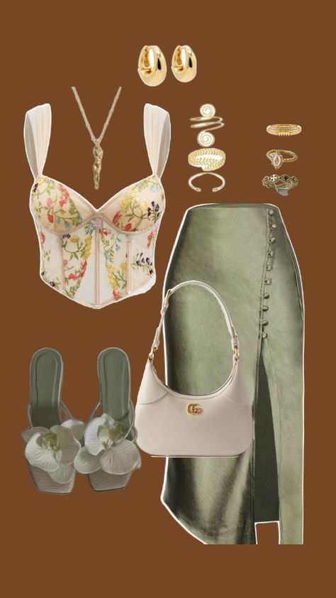 Embrace the essence of summer sophistication with this stunning look. The floral corset top paired with an elegant olive-green wrap skirt is the perfect balance of feminine charm and modern elegance. Elevate the ensemble with delicate gold accessories, a sleek ivory handbag, and floral-embellished heels that add a touch of whimsy. Whether it’s a sunset dinner or a night out, this outfit will have you turning heads. 💐✨ Green Skirt Outfits, Corset Top Outfit, Floral Corset Top, Olive Green Skirt, Sunset Dinner, Summer Date Night, Corset Outfit, Green Wrap, Floral Corset