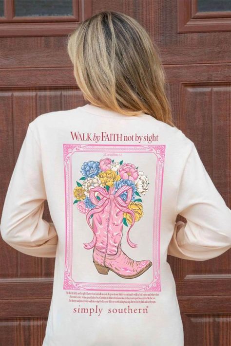 This Simply Southern Long Sleeve Walk By Faith T-Shirt for Women in Whisper is perfect for this Fall weather. This shirt features an adorable graphics, long sleeves, and lightweight construction. Features: Simply Southern Style: LS-WALK-WHISPER Color: Whisper 100% Cotton Simply Southern Shirts Long sleeves, crew neckline Simply Southern logo on sleeves, logo tag on hem Simply Southern logo and boot graphic on the left chest On the back: Country frame and boots with flowers and reads, “Walk by Faith not by sight” with a scripture verse above the Simply Southern logo Measurements from size small: Length from center back: 30” Chest: 38” Machine wash cold, tumble dry low Cute Christian Shirts, Jesus Merch, Southern Logo, Holding A Bouquet Of Flowers, Golden Poppy, Womens Christian Shirts, Color Whisper, Uplifting Phrases, By Faith Not By Sight