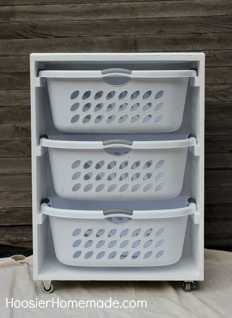 Managing laundry for a big household? Build a laundry sorter to hold everyone’s basket. | 29 Brilliant Ways To Organize Your Laundry Room Diy Laundry Room Storage, Laundry Station, Laundry Room Storage Shelves, Laundry Shelves, Room Storage Diy, Laundry Sorter, Laundry Room Diy, Laundry Baskets, Diy Laundry