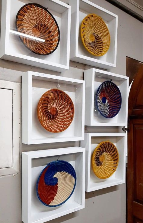 Hand woven interiore design contemporary art work wall hanging used as fruit basket african basket art wall plate wicker round bowl african basket wall display fabric bawls made of all natural fibres of sidal and sweet grass dyed with natural fibres hangloop backwall safe to use for food very decorative colourful traditional flower inspired talented artisans weavers boho baskets spital colourful baskets skills passed out through generation traditional Basket Wall Display, Contemporary Art Work, Art Work Wall, Boho Baskets, African Baskets Wall, Basket Art, Traditional Flower, Artwork Decor, Colorful Baskets