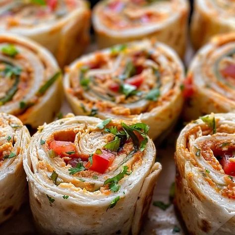 Learn to make Chicken Taco Mexican Pinwheels, a quick and tasty Tex-Mex appetizer. Perfect for parties and family gatherings! Mexican Pinwheels, Mexican Recipies, Taco Mexican, Chicken Pinwheels, Pinwheel Sandwiches, Tortilla Rolls, Southwest Chicken, Chicken Taco, Cajun Chicken