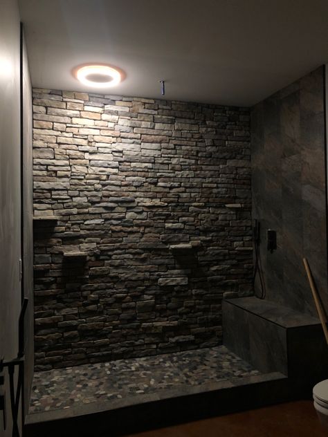 Rock Wall Shower Walk In, Stone Shower Shelves, Rock Wall Shower Ideas, Stone Veneer Shower Wall, Black Tile Master Shower Ideas, Bathroom Rain Shower Ideas, Rock Tile Bathroom Showers, Waterfall Shower Ideas, River Rock Shower Ideas