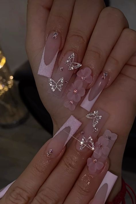 Pink French Tip Nails With Butterflies, Nail Ideas 3d Flowers Pink, 3d Flower And Butterfly Nails, Nail Inspo With Butterflies, Quinceanera Nails Butterfly, Pink French Tip Nails With 3d Flower, Acrylic Nail Butterfly Designs, Pink Quince Nails With Butterflies, Pink Rose Gold Quince Nails