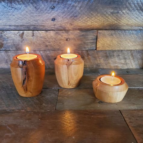 Set of 3 tealight holders made from cherry wood. When I turned the large and medium holder the cracks appeared, these are natural features of the cherry wood and will not interfere with the integrity of the holder and actually makes them unique. The holders are sealed with a mixture of beeswax and mineral spirits.  These holders will hold store bought foiled tealights nicely (not included). Large holder is 3 inches tall Medium holder is 2 5/8 inches tall Small holder is 1 3/8 inches tall Small Wooden Projects, Turned Candle Holders, Free Woodworking Project Plans, Tea Candle Holders, Reclaimed Wood Projects, Wood Projects That Sell, Small Woodworking Projects, Mineral Spirits, Wood Candle Holders