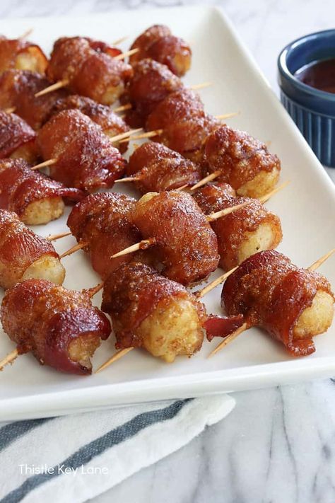 Bacon Wrapped Tater Tots Recipe - Bacon wrapped tater tots hit on so many flavor points, because they are crispy, sweet, savory and spicy. Bacon Appetizer Recipe. Bacon Wrapped Tots, Bacon Wrapped Tater Tots Brown Sugar, Bacon Wrapped Potato Bites, Tater Tot Appetizers, Bacon Wrapped Tater Tots, Bacon Appetizer, Bacon Wrapped Potatoes, Bacon Recipes Appetizers, Spicy Bacon