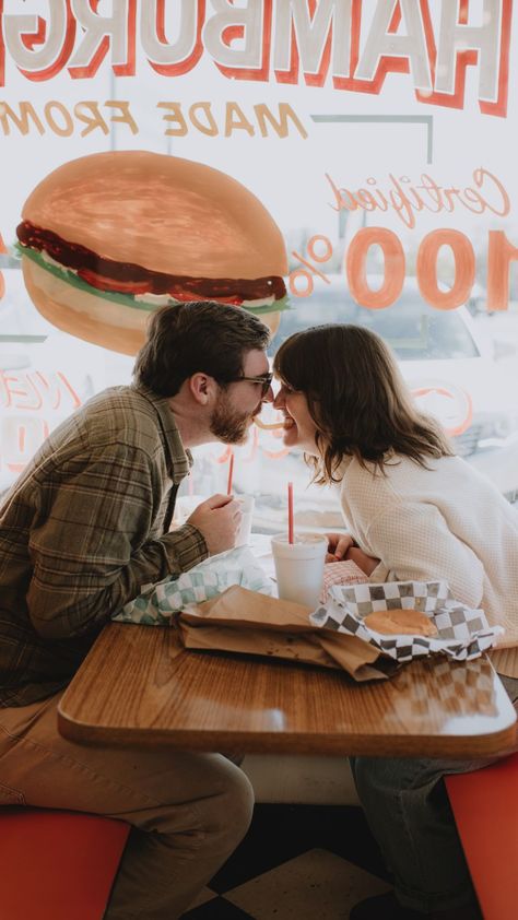 couple cheers-ing a burger at a local retro diner in waco texas. engagement photos by rebekah paul photography a Texas wedding and couples photographer. Diner Engagement Photos, Burger Fries, Burger Places, Unique Engagement Photos, Engagement Session Ideas, Retro Diner, Engagement Pics, Real Couples, Full Circle