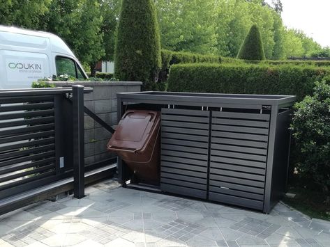 The photo shows a StyleOUT® waste enclosure placed on a driveway Bin Enclosure, Marina Village, Waste Container, Waste Bin, Bodo, Bathroom Layout, Storage Bins, Outdoor Storage Box, Metal Decor