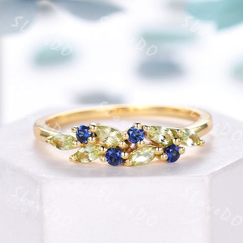 You are looking at a natural peridot and sapphire wedding ring.Vintage peridot wedding band,14k gold ring,cluster marquise peridot sapphire ring,August birthstone ring,stacking band,gift for women,Christmas gift You can choose the other side stone as you like: Alexandrite: www.etsy.com/listing/1506185634/vintage-peridot-wedding-band18k-solid? Amethyst: https://www.etsy.com/listing/1548477346/vintage-peridot-wedding-band14k-solid? Emerald: https://www.etsy.com/listing/1548483528/vintage-peridot-w Peridot And Sapphire Ring, Peridot Wedding Band, Birthstone Wedding Band, August Birthstone Ring, Saphir Ring, Ring Cluster, Cute Engagement Rings, Lapis Ring, Wedding 2025