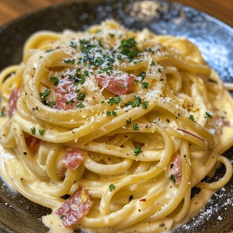 ## *Creamy Carbonara: A Taste of Italy in Every Bite* Indulge in the rich flavors of Italy with this classic *Pasta Carbonara* recipe. This dish is surprisingly simple to make, yet it delivers an explosion of taste that will transport you straight to the heart of Rome. *Ingredients:* * 1 pound spaghetti or fettuccine pasta * 1/2 pound pancetta or guanciale, diced * 4 large eggs * 1 cup freshly grated Pecorino Romano cheese, divided * 1/2 cup freshly grated Parmesan cheese, divided * 1/4 cu... Olive Oil For Cooking, Italy Recipes, Creamy Carbonara, Pasta Carbonara Recipe, Alfredo Sauce Recipe Homemade, Pork Cheeks, Pecorino Romano Cheese, Fettuccine Pasta, Pecorino Romano