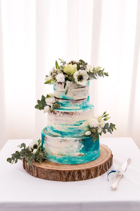 A teal buttercream cake decorated with fresh flowers. Teal Wedding Cakes, Wedding Cake Teal, Dark Teal Wedding, Turquoise Wedding Cake, Dark Teal Weddings, Wedding Cake Toppers Letters, Teal Wedding Cake, Teal Cake, Letter Cake Toppers