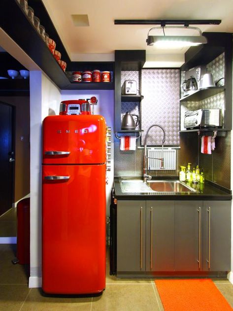 Transform Your Kitchen With a Removable Backsplash | HGTV Retro Bungalow, Stainless Steel Kitchen Backsplash, Modern Konyhatervezés, Red Refrigerator, Metal Backsplash, Retro Kitchen Appliances, Retro Style Kitchen, Tiny Kitchens, Future Retro