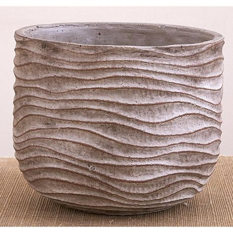 This unique planter vase features etched wave designs with ridges to add texture and depth to any room space. Perfect for adding a natural touch to floating shelves, tabletops, or mantles. Constructed out of durable cement, simply add a succulent or plant to beautifully transform this rustic planter pot. Rustic Planter, Ceramic Succulent Pots, Vase Tall, Terracotta Bowl, Pottery Patterns, Pottery Pots, Rustic Planters, Ceramic Texture, Unique Planter