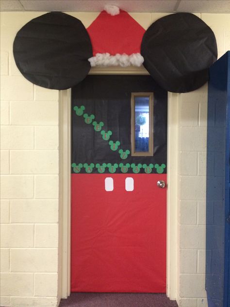 Christmas Mickey Mouse door by Mrs. Torres WHCA Mickey Christmas Door Decor For School, Mickey Classroom Door, Mickey Mouse Christmas Bulletin Board, Christmas Disney Door Decorations, Mickey Mouse Christmas Classroom Door, Disney Christmas Door Decorations Classroom, Disney Christmas Classroom Door, Mickey Mouse Christmas Door Decorations, Disney Christmas Classroom