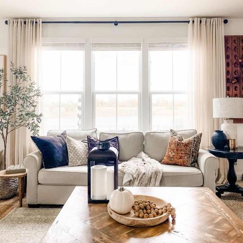 Styling In Front Of Living Room Window, Couch In From Of Window, Curtains For Three Windows In A Row Living Room, Couch Along Window, Couch In Front Of Large Window, Loveseat In Front Of Window, How To Style 3 Windows In A Row, Curtains In Living Room Behind Couch, Curtains Living Room Three Windows