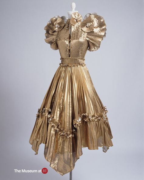 Zandra Rhodes, Gold lamé evening set, 1981, England. Gift of Mr. Bouke De Vries.

Learn more about All That Glitters... at The Museum at FIT. On view February 26 – March 23, 2025
 
Photo by Eileen Costa Fashion History Timeline, Zandra Rhodes, 1980's Fashion, 20th Century Fashion, Fashion Institute, Camisole Dress, 1980s Fashion, Historical Clothing, Matching Dresses