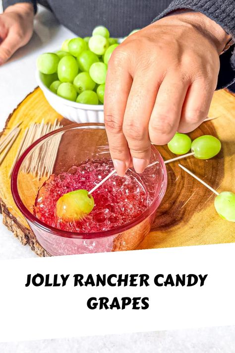 Candy grapes are sweet and sour candy-coated grapes, dipped in melted jolly ranchers then more crushed candy for a delightful crunch. Candied Jolly Rancher Grapes, Candy Grapes Jolly Rancher, Sour Candy Dessert, Grapes And Jolly Ranchers, Jolly Rancher Candy Apples, Melting Jolly Ranchers In Microwave, How To Make Candied Grapes With Jolly Ranchers, How To Make Candy Grapes With Jolly Ranchers, Candied Grapes Recipes Jolly Rancher