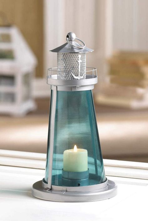 Silver Lighthouse with Blue Glass Candle Lantern Lighthouse Lantern, Beach Wedding Candles, Candle Lanterns Wedding, Blue Lighthouse, Lighthouse Candle Holder, Nautical Centerpiece, Nautical Lanterns, Nautical Candles, Lantern Centerpiece Wedding