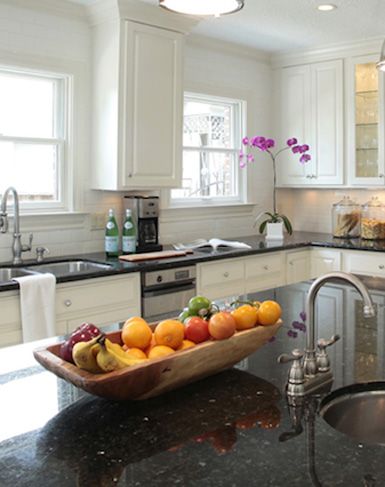 Arrange colorful fruit in a natural wood tray for a long space or large island Countertop Fruit Storage Kitchen, Fruit Bowl Kitchen Counter Space, Fruit Bowl Island Centerpiece, Wood Fruit Bowl Kitchen, Storing Fruit On Counter Ideas, Fruit Bowl On Kitchen Island, Fruit Bowl On Island, Fruit Bowl For Countertop, Big Fruit Bowl