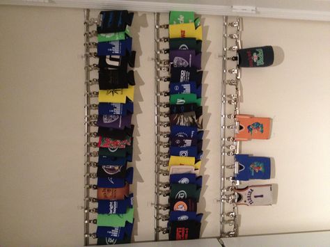 Coozie display with cafe rods, rod clips, bulldog clips, and 3m hooks. Love the outcome! Stubby Holder Storage, Koozie Display Ideas, Coozie Holder Diy, Koozie Organization, Koozie Storage Ideas, Koozie Storage, Koozie Display, Cooler Storage, Sport Room