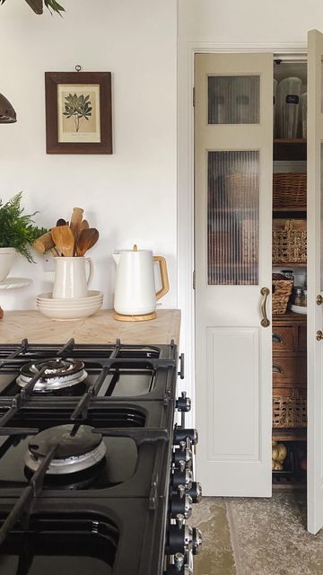 Anna King on Instagram: "I made these pantry doors a few years ago from some pine bi-fold doors I picked up in the sale! I wanted them to resemble bakery style doors so I stained & distressed them & added vintage rolling pins for handles!  They have been much loved over the years & have been the most talked about feature in our home! It seems a lot of you love the rustic & unique look!  But as time goes by my tastes have change & I wanted a cleaner & more modern look so I decided to give them a little makeover!  I started by removing the top 2 panels to create windows, sanded & filled before painting with @farrowandball in the colour Dropcloth!  For the frosted windows, I measured the open spaces & got some Perspex cut to size @cutmy.uk This was soooo much easier than cutting them myself! Frosted Door Pantry, Small Pantry French Doors, Folding Pantry Doors, Pantry Door With Window, Diy Pantry Door Makeover Ideas, Small Pantry Doors, Modern Farmhouse Pantry Door, Pantry Room Door, Small Pantry Door Ideas