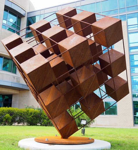 Sator Cube by Art Fairchild is near the front entrance to the Arlington subcourthouse, 700 E. Abram. The 1,800-pound, nine-foot tall piece has 35 six-sided steel cubes welded at the corners, a balance of positive and negative spaces. The name derives from the Sator Square, a word square containing a five-word Latin palindrome (a word or number that reads the same backward as forward). Clearly it must be precisely balanced. Square Sculpture, Cubic Sculpture, Cube Installation, Cube Sculpture Design, Angular Sculpture, Concept Board Architecture, Historical Statues, Cube Design, Architecture Collage