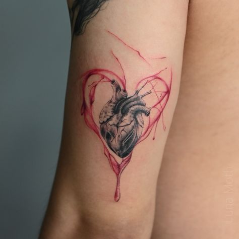 . Done by Angelina @chase.ink.you This stunning tattoo design blends anatomical precision and abstraction in one artwork! The black heart, as if taken straight from a biology textbook, is surrounded by a blood-red outline that adds powerful contrast and depth. 🖤❤️ This tattoo design is a reminder of the physical basis of our emotions and life’s vitality. The red color symbolizes passion, love, and strength all at once. Ready to charge up with emotions? Come express your uniqueness at our ... Red Heart Tattoo Designs, Emotions Tattoo Ideas, Colored Heart Tattoo, Dark Heart Tattoo, Red Black Tattoo, Biology Tattoo, Black Red Tattoo, Anatomical Tattoos, Black Heart Tattoos