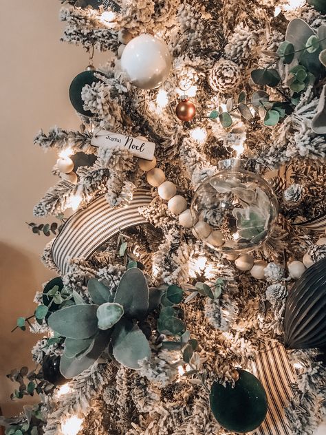 Boho Farm 2019 Christmas tree  #boho #bohemian #farmstyle #style #farm #christmas #tree #home #decor #green #plants #wood #beads #wicker #ornaments #flower #diy White Ornaments Green Christmas Tree, Christmas Tree Styles 2023, Green Boho Christmas Tree, Glass Dome Decor Ideas Living Room, Tan And Green Christmas Tree, Flocked Christmas Tree With Green Decor, Sage Green And Black Christmas Tree, Diy High End Ornaments, Boho Rustic Christmas Decor