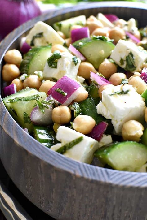 This Chickpea Cucumber Feta Salad has ALL the best flavors! Loaded with chickpeas, cucumbers, red onions, feta cheese, and fresh basil....this salad is so easy to make and is the perfect side dish for any meal! Pineapple Feta Salad, Chickpea Cucumber Feta Salad, Chickpea Cucumber, Chickpea Feta Salad, Chickpea Feta, Salad Calories, Cucumber Feta Salad, Lemon Tree Dwelling, Lunch Bowls