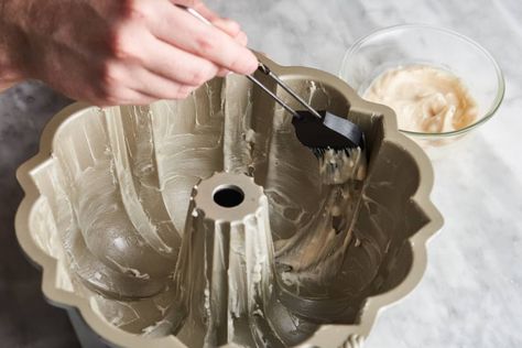 someone rubbing cake goop onto a bundt cake pan How To Get A Cake Out Of A Bundt Pan, Cake Goop, Cake Release, Brown Sugar Cakes, Bundt Pans, Baking Techniques, Pastry Brush, Baking With Almond Flour, Waffle Cookies