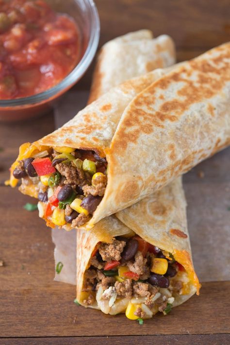 A close up of two Crispy Wraps filled with ground beef, black beans and vegetables Southwest Wraps, Southwest Tacos, Lime Coleslaw, Navajo Tacos, Sandwich Vegetarian, Recipe Diaries, Southwest Recipes, Bacon Mushroom, Pork Rind